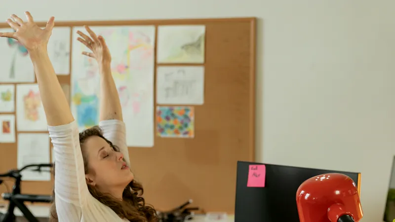 Office employee taking a desk stretch break